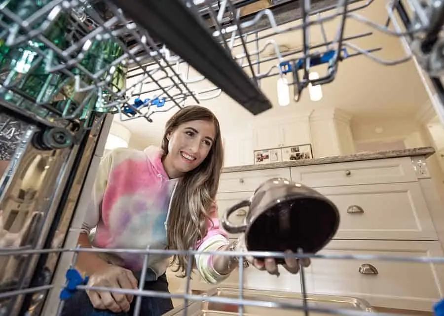 Melissa Maker loading the dishwasher