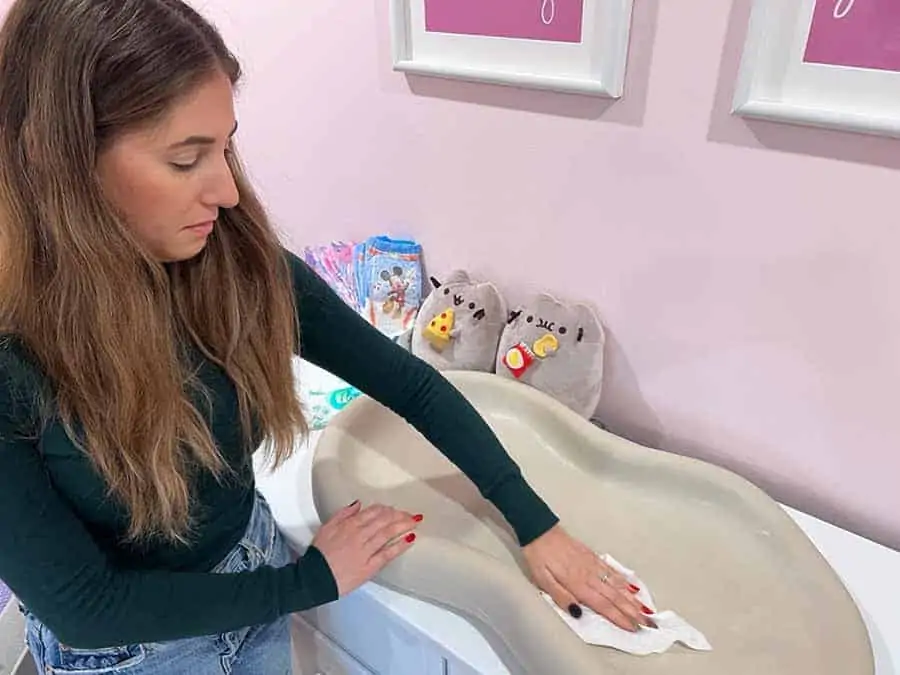 Melissa Maker cleaning baby changing table