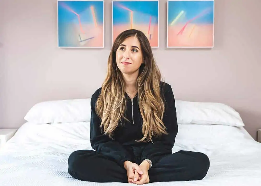 Melissa Maker Sitting on her bed